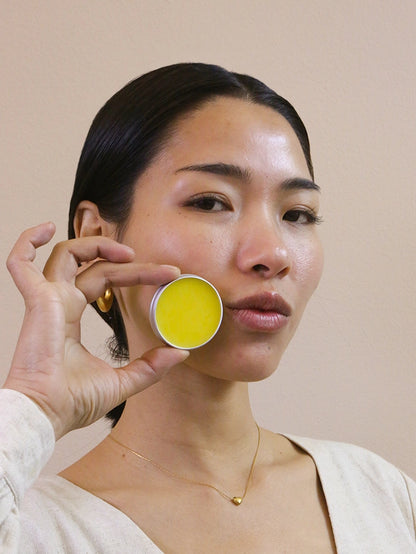 Woman posing with mad honey lip balm